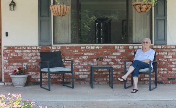 Woman sitting in a repaired home